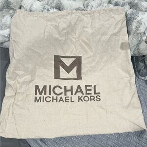 Michael Kors Tan Bag with Iconic Logo and Protective Design